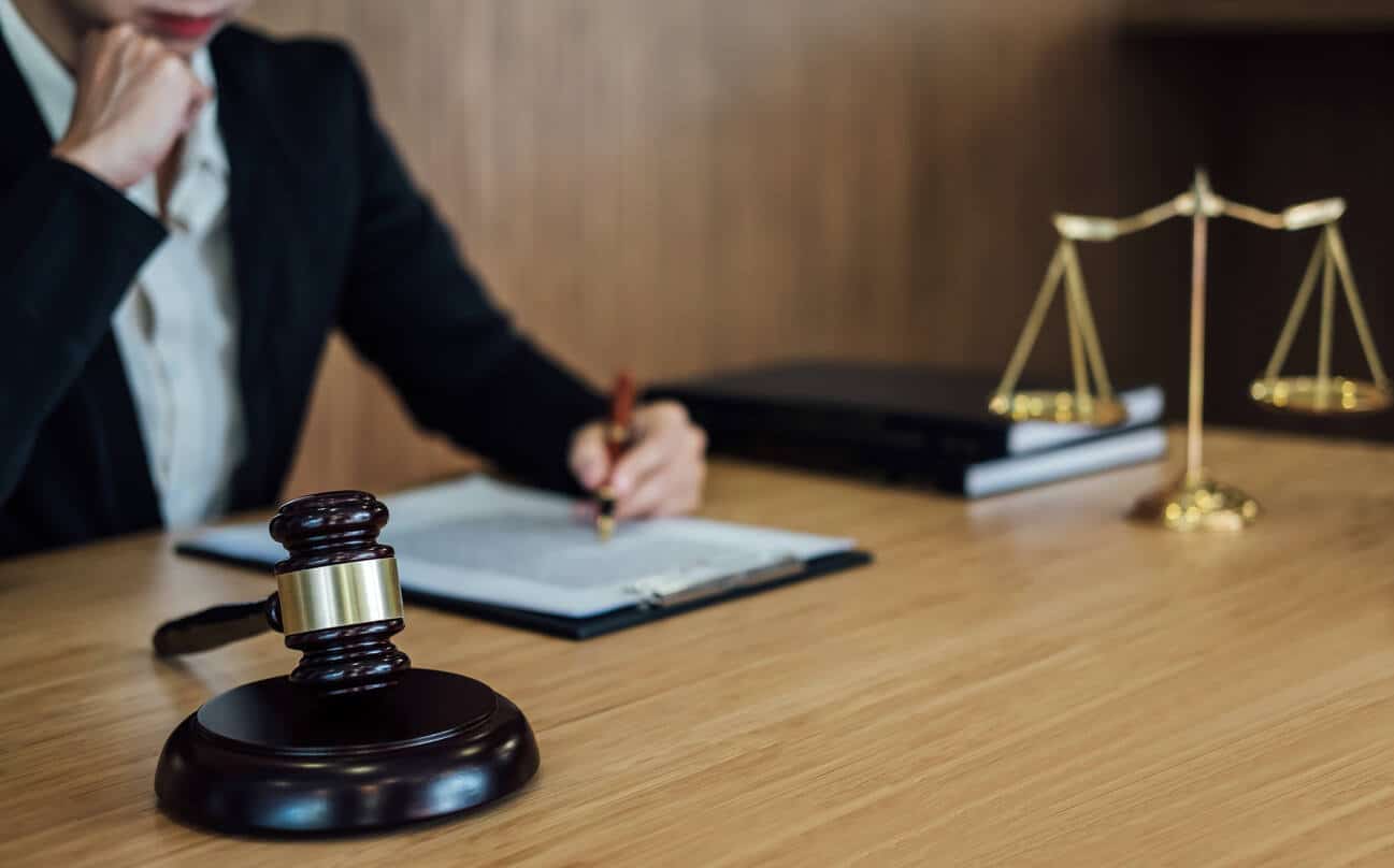 lawyer gavel on the wooden table and lawyer working